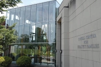 A view of the multiple-story windows of the Oneill healthy families center