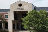 The front of the Sheilds Visual Arts Center with a large tree on the righthand side