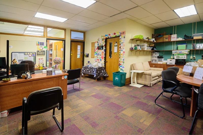 The Marywood Residence Life Office filled with desks and a couch