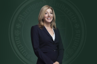 Marywood's 13th President Lisa A. Lori is pictured in a dark blue suit against a green backdrop with the Marywood seal.