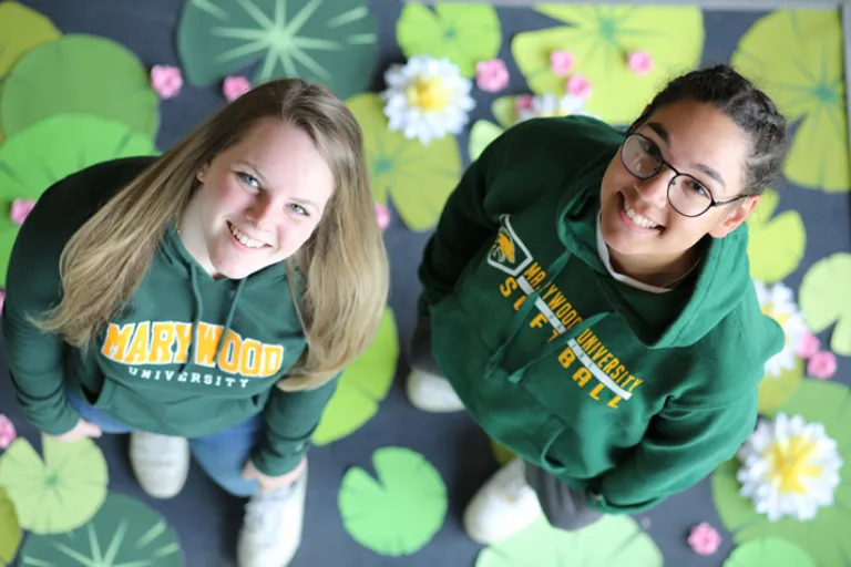 Two Marywood students looking up at the sky