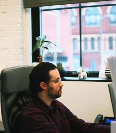 Anthony-Cicco-works-at-desk-at-Fancy-Parsley-office.jpg