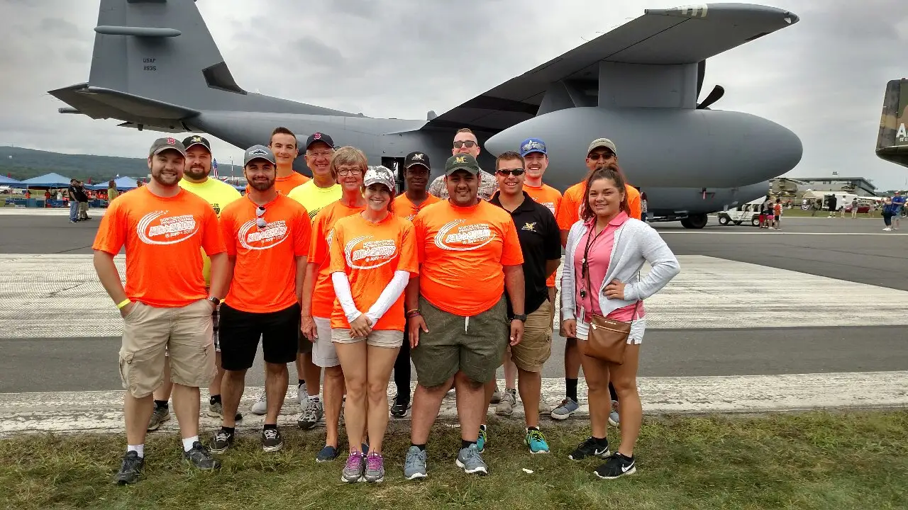 Members of Marywood's aviation club standing in front of a plane