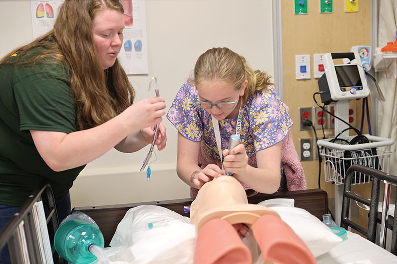 Two Marywood students working on a lab together